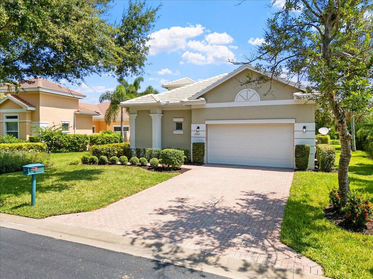 Luxury awaits in this 2,722 sqft concrete-block home! Featuring 3 beds, 3 baths, impact windows/doors, stunning lake views, and space for a pool. Enjoy volume ceilings, top-tier finishes, a chef's kitchen with island, SS appliances & granite. The luxurious master suite has a custom walk-in. Plus, a formal dining room, private den/office, and split-floor plan. Access a clubhouse, pool, tennis, fitness, social/card rooms, and library.