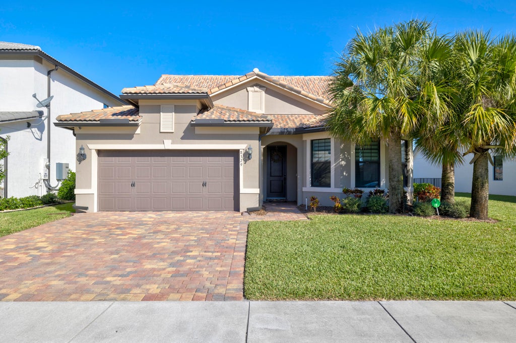 Photo of 8329 Cinch Way Way, Lake Worth Beach, FL 33467 (MLS # R10773092)