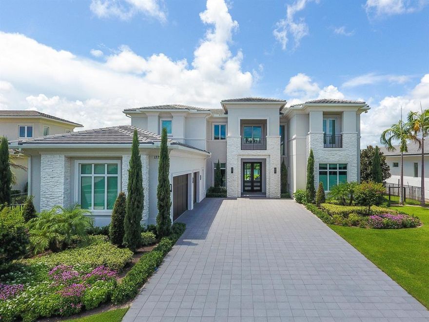 This stunning Transitional Modern estate home is located on over half an acre of pristine waterfront property in the private enclave of Frenchman's Harbor. No stone was left unturned in its immaculate construction and tastefully appointed professional decor. A grand entry way delivers a palatial experience with its two-story foyer and floor to ceiling glass windows, which flood the home with natural light. This 5 bedroom, 5.5 bath home features two master suites, one on the ground floor and one on the second floor, as well as two separate living spaces. The gourmet kitchen boasts high-end finishes and top of the line appliances from Jenn-Air , Subzero and  WOLF.