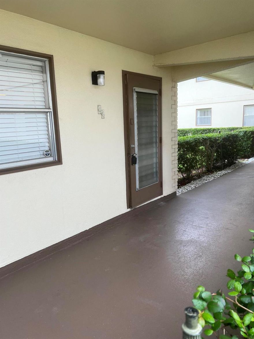 This first floor condo unit is located on a dead-end cul-de-sac street The community requires at least one person to be 55 or older to be approved for occupancy. The condo has a pedestrian gate that opens to Jog Road...easy walking to Publix, Walgreens, place of worship, and much more.