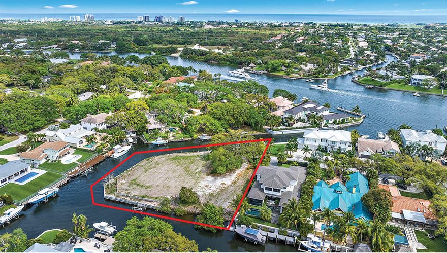Located just off the Intracoastal this acre + vacant lot offers a safe harbour with 400' of frontage, NEW sea wall, two docks & an 8,000lb boat lift. Build your oversized dream home here, zoning allows for a 20,000 sq ft + estate.Plans available to build home in renderings.