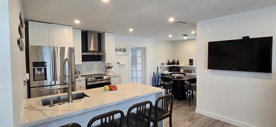 Coming Soon! Beautifully updated 2-bedroom, 1-bath home with EXTRA Florida Room in the heart of Oakland Park! Perfect opportunity for first-time homebuyers, investors, seasonal residents, or potential Airbnb use. This home features an open floor plan, updated kitchen with newer appliances, and a bright functional layout ideal for entertaining and everyday living. Major updates include a 2020 roof and porcelain flooring installed in 2020 beneath the current laminate flooring. Conveniently located approximately 5 minutes from the train station, offering easy access for commuters and travelers, and only 8 minutes from beaches, shopping, dining, entertainment, and major highways. Enjoy South Florida living with close proximity to Fort Lauderdale, Miami attractions, and coastal activities. Electric panel replaced 2024, Tankless water heater 2020, Appliances 2024- Washer and Dryer do not convey.  New FULL Atic and walls Insulation.