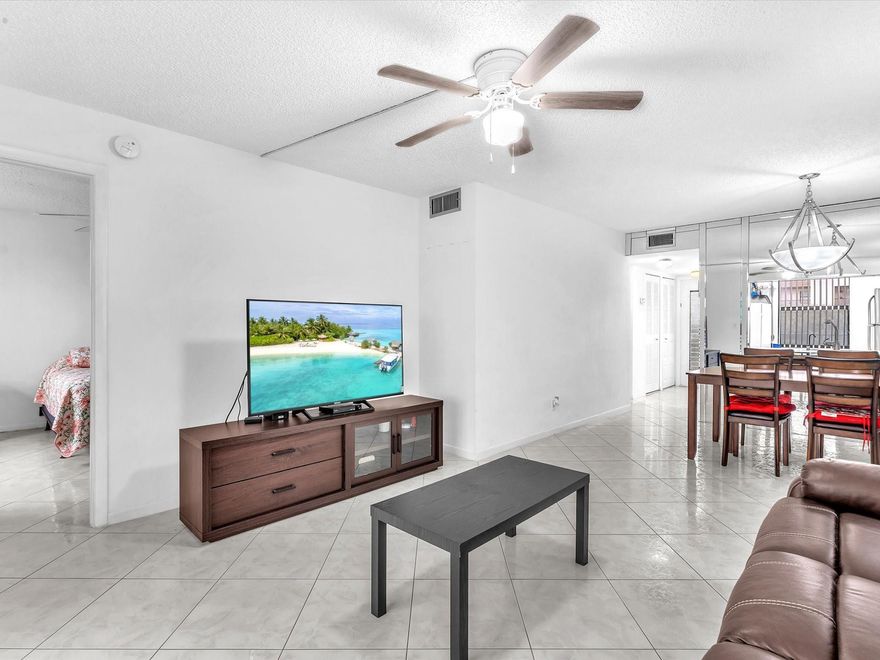 MOTIVATED SELLER!! Sought-after Phase 4 unit with breathtaking views of the lake, fountain, treetops, and golf course. This updated 2 Bed 2 Bath features brand-new washer/dryer in unit, all-tile floors, modern bathrooms and recessed lighting throughout. This well-maintained 55+ community offers fantastic amenities, including a clubhouse, fitness center, theater, billiards, multiple pools, tennis, a courtesy bus, and more! 40-Year Inspection Completed & Reserves in Place. No minimum down payment required only 700 credit score.