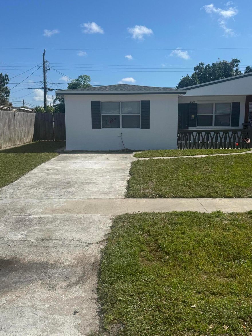 Charming 2-bedroom, 1-bath villa in West Palm Beach offering no HOA and incredible flexibility. This property features a private driveway plus a spacious side yard—perfect for additional vehicles, boats, or toys.  Inside, enjoy an updated layout with stainless steel appliances, a 2025 water heater, and a 2026 roof for peace of mind. Step outside to a fully fenced backyard, complete with a screened enclosure and storage shed—ideal for entertaining or relaxing in your own private space.  A rare opportunity combining convenience, updates, and freedom with no restrictions.