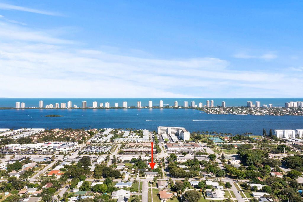 Photo of 137 Hawthorne Drive, Lake Park, FL 33403 (MLS # R11132588)