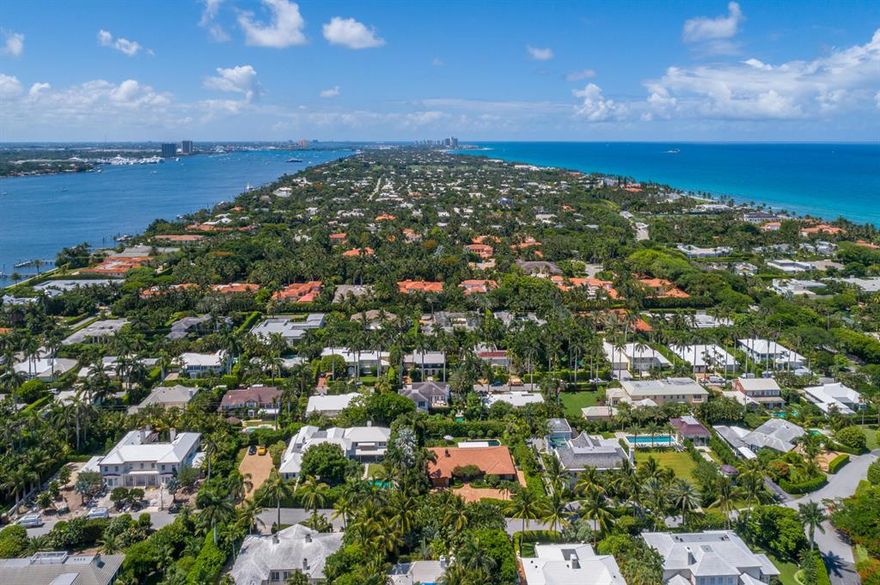 Stunning nearly new 2012 residence by Woolems Home and designed by Smith & Moore Architects offers every feature of a Smart home. Situated close to town, The Breakers Hotel, Worth Avenue, Lake trail and the Beaches of Palm Beach make this a most desirable location Lushly landscaped property affords the utmost of privacy. Wonderful floor plan with grand living areas, high ceilings, grand master suite, with separate office, library, gym, impact glass throughout. generator and two car garage.