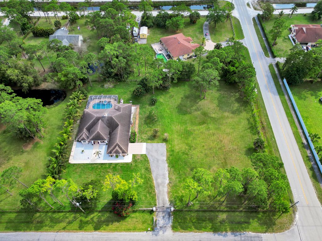 Photo of 12450 N 63rd Lane N, West Palm Beach, FL 33412 (MLS # R10970284)