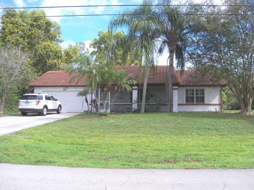 A Beautiful 2 Bedroom & 2 Bath Home w/a  2 Car Garage & a Barrel Tiled Roof. Nice Front Screened porch Welcomes you into this Light & Airey home. Living Room w/Vaulted Ceiling, Plantation Shutters, & Ceramic Tiled Floors. Dinning Room adjacent to the updated Kitchen w/newer Cabinets, Granite Counter Tops, & Newer Appliances. Dinning Room & Kitchen overlook the large Screened Back Porch w/access to the back thru Sliding Glass doors. Good sized Master Bedroom & Bath. Nice 2nd bedroom & well kept 2nd bathroom. Oversized two car garage for extra storage areas. Large screened back porch overlooking back yard partially fenced w/a storage shed. Some of the upgrades include Ceramic tile, Newer A/C system, Recently Painted Interior, Updated Kitchen & More! Home in Good Shape but being Sold ''As Is'