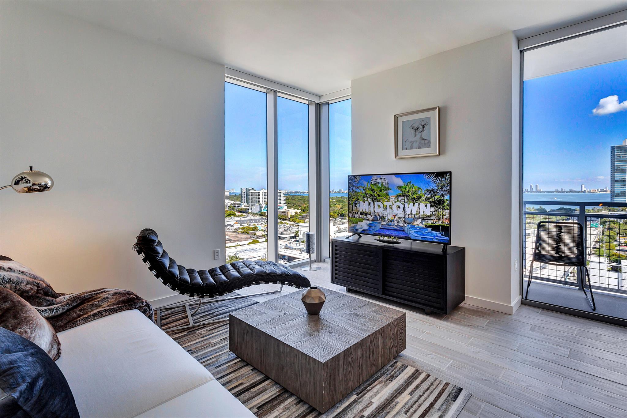 Eve at the District offers resort-style pool with cabanas, 24-hour concierge, walking distance to Design District Shopping, clubhouse, co-working lounge, state-of-the-art 24 hour fitness center, yoga studios, summer kitchen with BBQ grills, and a dog park.
