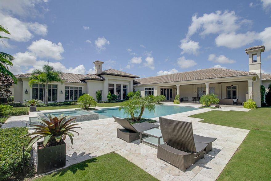 Impeccable custom estate home on a one acre home site with private preserve view.  This home was recently built in 2015 and features an open, light and bright floor plan with marble and wood floors, beautiful wood details, handsome study, 200 bottle wine storage, two master bedrooms and two master baths, fireplace, built in wall units and private guest suite.  The backyard boasts a custom infinity edge pool and spa, outdoor summer kitchen, covered and open lanai, cypress ceilings and tropical views of paradise.