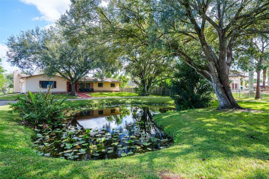 Bring your horses and enjoy wide-open living in Country Club Ranches. This 4-bedroom, 2-bath ranch-style home sits on over an acre with expansive green space and beautiful mature oak trees. The layout includes 2,200+ sq ft of living space featuring formal living and dining rooms, a comfortable family room with brick fireplace, a large screened patio, and a 2-car garage. The interior is well-maintained and move-in ready, with excellent potential for future updates or personal touches. The property offers plenty of space to add a barn, paddocks, pool, or guest house. A rare opportunity to create your own private homestead in a peaceful, rural setting—just minutes from city conveniences.