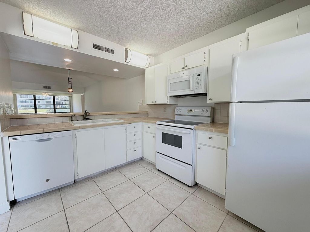 Photo of 3511 Village Boulevard #Unit 103, West Palm Beach, FL 33409 (MLS # B26026407)