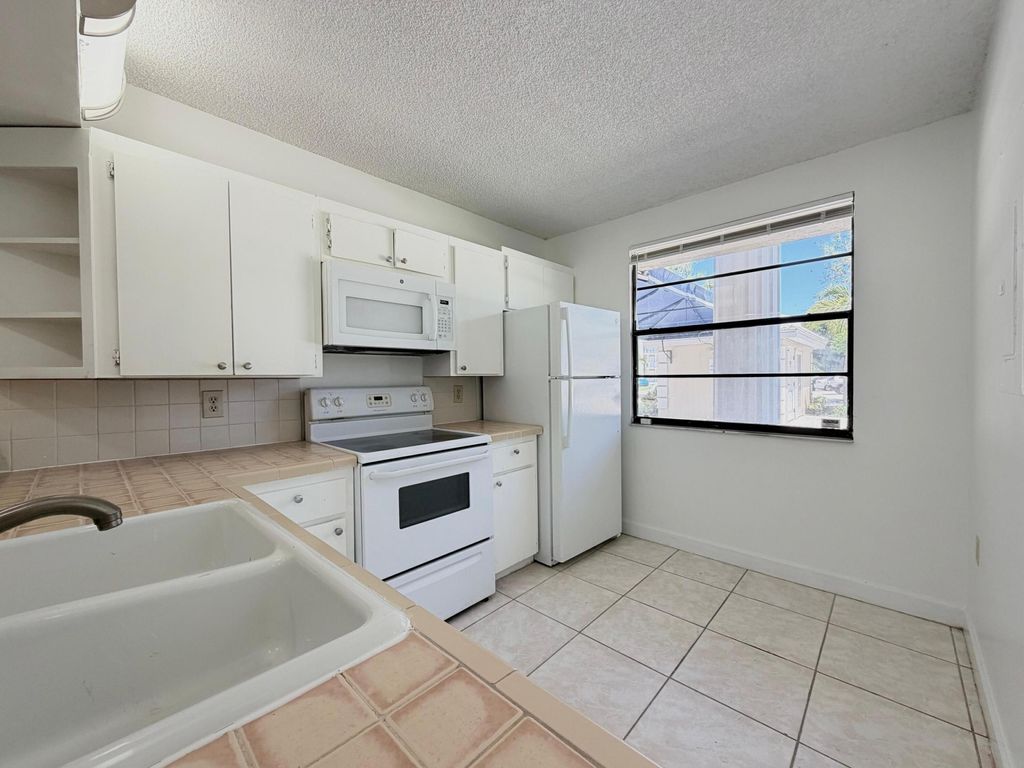 Photo of 3511 Village Boulevard #Unit 103, West Palm Beach, FL 33409 (MLS # B26026407)