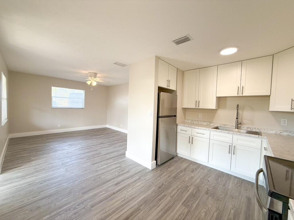 This completely renovated 2-bedroom, 1-bathroom apartment offers a fresh and modern living space. The kitchen is equipped with brand-new appliances, perfect for all your cooking needs. You'll also have the convenience of an assigned parking space, so no more searching for parking!Located in the heart of Lake Worth, this unit is just minutes away from popular restaurants, shopping centers, and provides easy access to major roads, making your daily commute a breeze. Managed by a top-notch management company that genuinely cares about its tenants, this unit is a gem that won't be on the market for long.