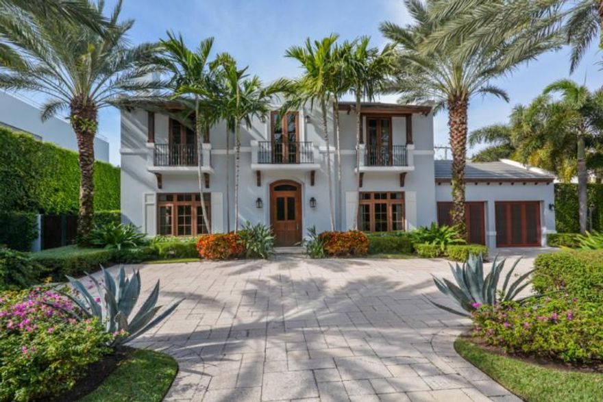 This spectacular Northend Palm Beach home is waiting for your enjoyment. Gracious and spacious, the flow of this home easily accommodates cozy family evenings or large scale entertaining. You will benefit from the exceptional craftsmanship used to incorporate stunning materials from around the world, a such as the stone and wood floors throughout. Guests will be beckoned to participate with the chef in the open gourmet kitchen with custom cabinetry, granite counters and exceptional appliances.  Easily accessed from the grand family room, the expansive loggia is the perfect place to unwind. Cool off in your fabulous, large pool, hydrate at the built-in wet bar with refrigerator, and then warm yourself by the wood burning fireplace as you take pleasure in your lushly landscaped yard. Located close to the beach and clubs and convenient to everything Palm Beach has to offer.