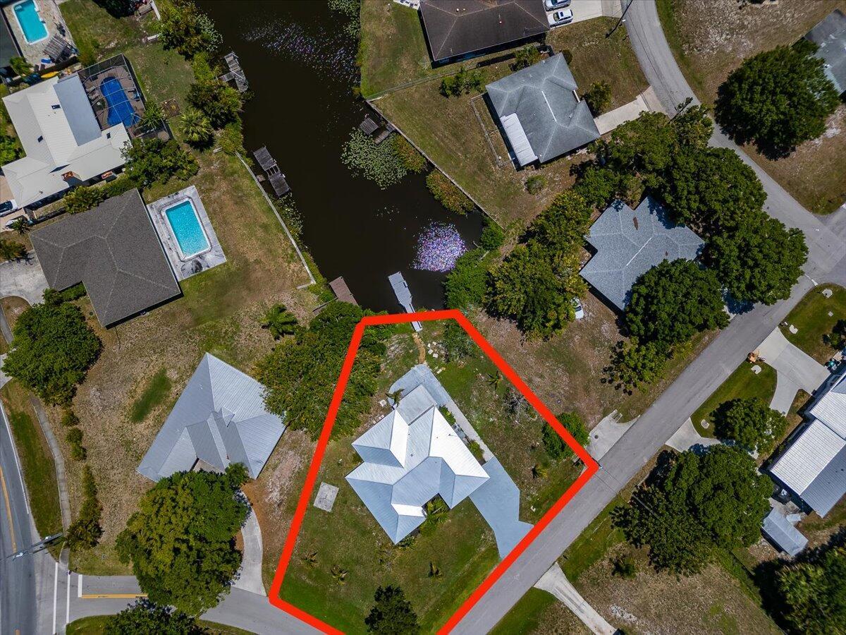 SELLERS MOTIVATED Newly renovated.Florida Waterfront living!!WATERFRONT PRICE NEGOTIABLE FULLY RENOVATED BUNGALOW HOME WITH 60 FEET OF WATER FRONTAGE ON A LARGE CORNER LOT OF OVER 1/3 ACRES. Home is located on the END OF the CANAL that leads out to the St.LUCIE RIVER leads to the Indian River Lagoon to the OCEAN Inlet. KITCHEN renovated with New European Style modern Cabinets. Beautiful Quartz countertops through-out. UpGRADED showers with chrome fixtures. Beach Wood-look tiles laid in a Chevron pattern. New Roof. New AC. Come enjoy the Florida lifestyle with this MOVED IN READY home right on the water. Venture out to your OWN DOCK and catch some fish or just take your boat out for a Cruise. Endless activities and opportunities