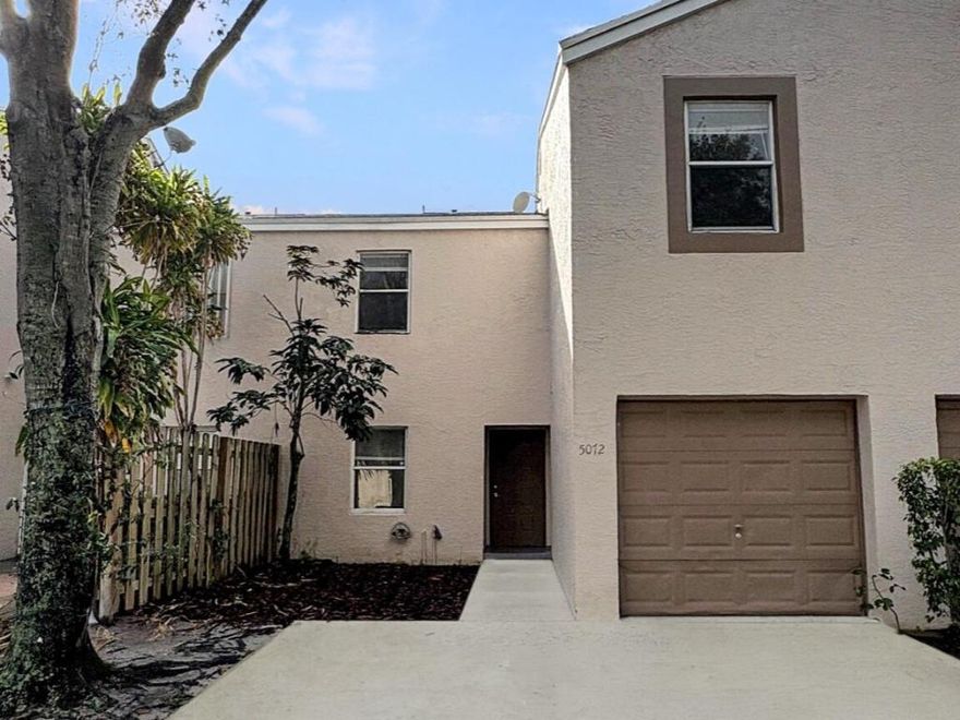 Welcome home to this charming townhome offering over 1,700 square feet of comfortable living space and a one-car garage. Step inside to discover a spacious kitchen, ready for you to move right in. The open layout features a service counter into the dining area, perfect for entertaining or casual meals. Enjoy easy maintenance with tile flooring throughout the first floor and the convenience of a bedroom located downstairs. Upstairs, you'll find a cozy loft, ideal for a home office, reading nook, or play area. Relax and unwind outdoors on your private, fenced patio, offering the perfect spot for morning coffee or weekend barbecues. This spacious and beautiful townhome combines style, comfort, and convenience—all in a great West Palm Beach location close to shopping, dining, and major highwa ys.