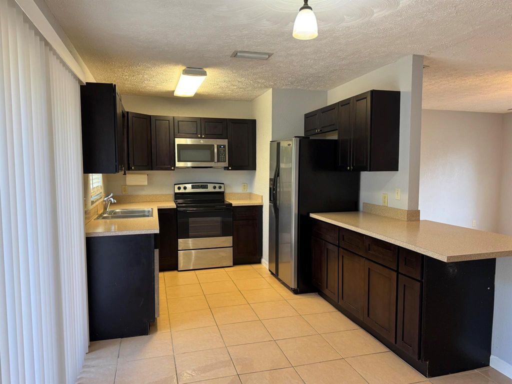 Photo of 1841 SW Mcallister Lane, Port Saint Lucie, FL 34953 (MLS # R11099363)