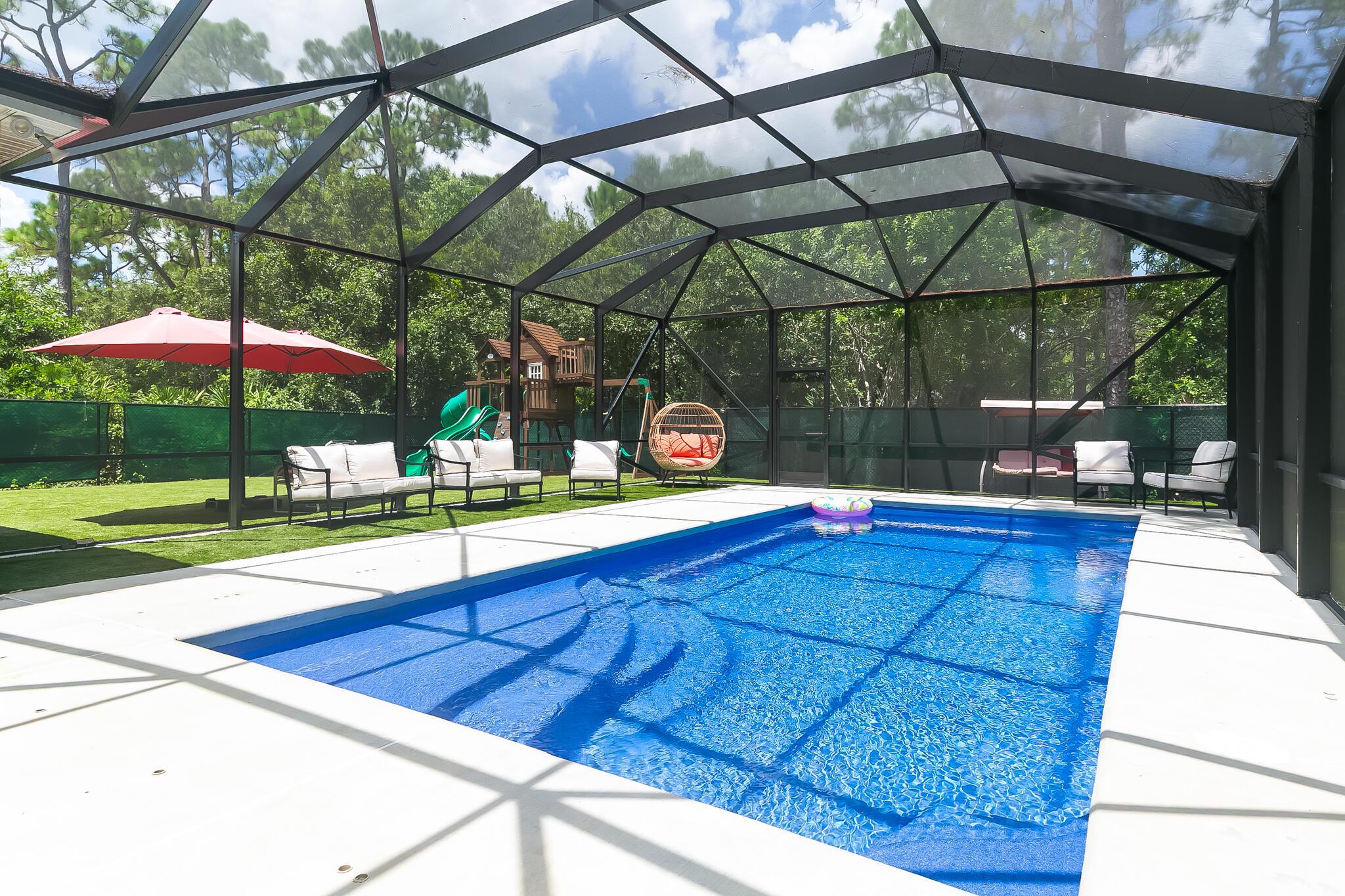 Discover this stunning pool home featuring 6 bedrooms, 4.5 baths, and a 3-car garage on nearly 1/3 acre in the exclusive, gated community of Oak Alley. With impact-resistant hurricane windows and doors throughout and over $125K in whole-house solar panels and backup batteries (paid off at closing by seller), this property offers unmatched efficiency and peace of mind.Inside, enjoy a thoughtfully designed floor plan with a gourmet kitchen boasting double ovens, 42-inch cabinets, granite countertops, and stainless steel appliances. The oversized master suite offers two spacious walk-in closets, while a large first-floor bedroom with a private bath can serve as a second master suite.