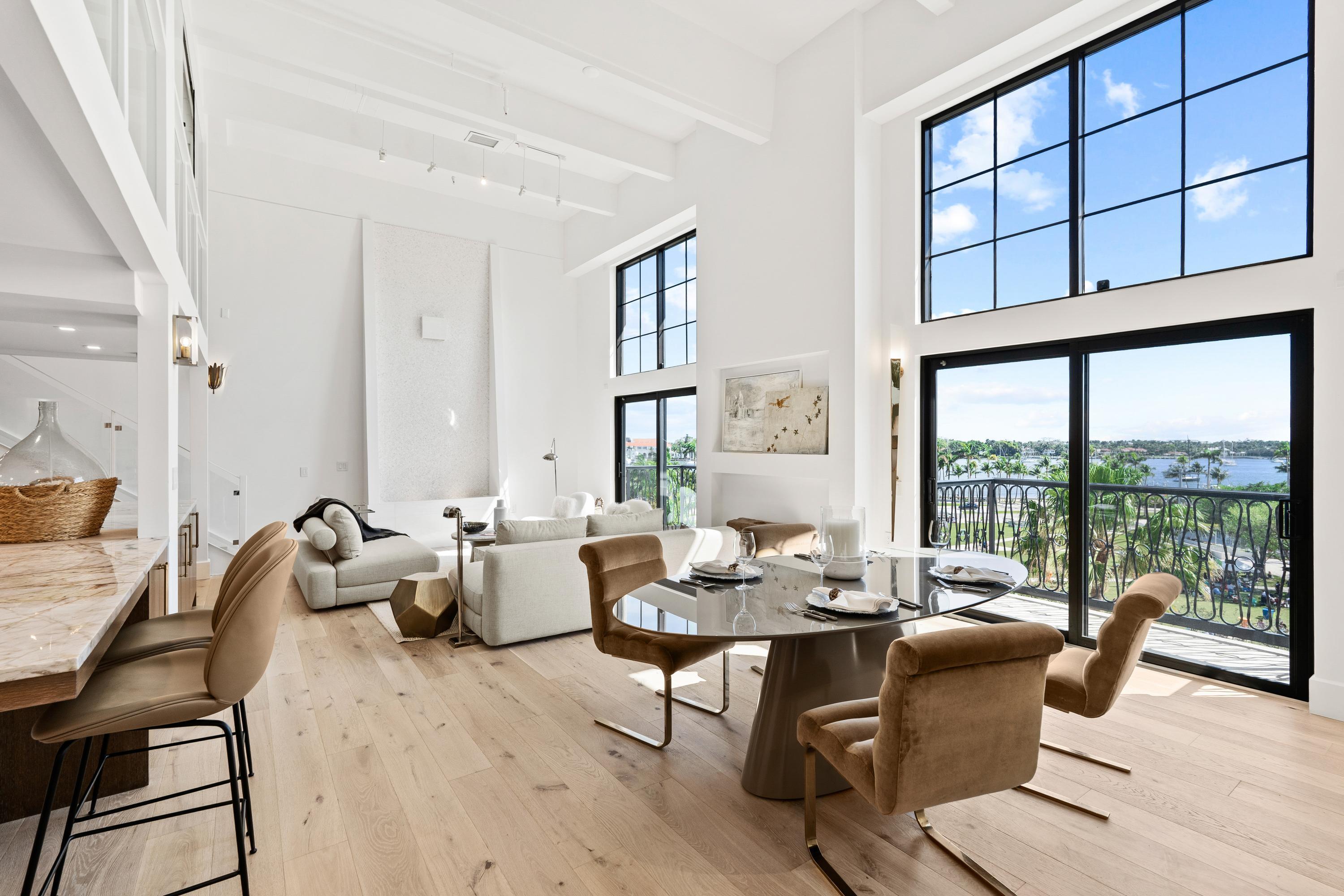 WATERFRONT ZEN.New Development-Private Penthouse style Oasis w/17' High Ceilings;Rare Find! This Uber Chic Loft has unobstructed 47' wide open Water and Park Views.Walk to everything Lifestyle! All New Boasting 3 balconies, the finest materials, high-end appliances, chef's custom kitchen w/huge Island, genuine Oak floors, custom cabinets and closets, Impact windows. Turn Key vacation or year round home or Investment-can be leased 2 times a year. 3 Parking spaces on same level,Pets Welcome,24-hr Security, lowest HOA's for comparable buildings WPB.No structural assessments