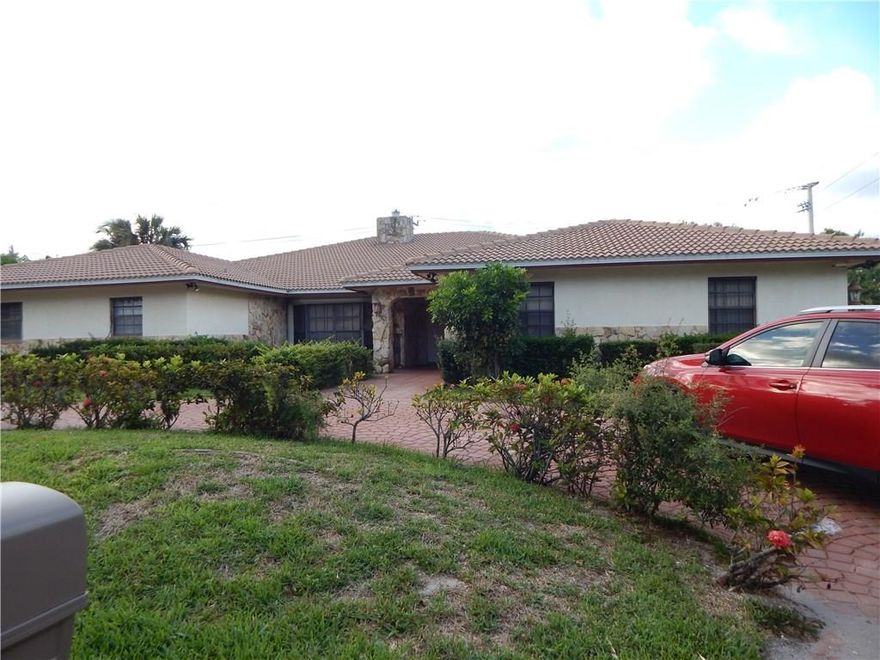 AN INVESTOR'S DREAM! NO HOA! 4/3 + a den LARGE bedrooms/Kitchen, beautiful brick Fireplace, large covered patio-screened pool/spa Large corner lot with fruit trees. only needs cosmetic upgrades and some TLC to make a beautiful family home.  NEW ROOF replaced from Katrina storm. Best schools in Palm beach 5 minutes from Deerfield beach. this house has so many extra, man cave/workshop. DID I say NO HOA!!!!!