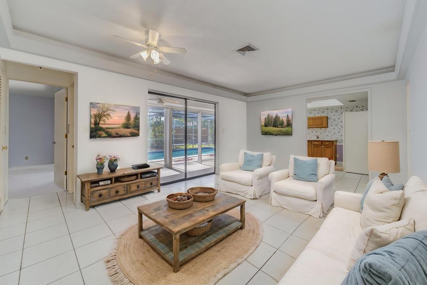 Welcome to this spacious 3-bedroom, 2-bath home offering 2,300 square feet of living area in the highly sought-after community of Hollywood Hills. With great bones and endless potential, this home is ready for your personal touches to make it truly your own. Designed with entertaining in mind, the floor plan features an expansive living area, a separate family room, and a generous dining space. With so much room, there is even the possibility of converting it into a 4-bedroom home. The primary suite includes a walk-in closet and direct access to the pool and patio area. Step outside to the covered patio and enjoy the Florida lifestyle year-round. Ideally located just minutes from shopping, restaurants, and hospitals, this home offers space, flexibility, and an excellent location.