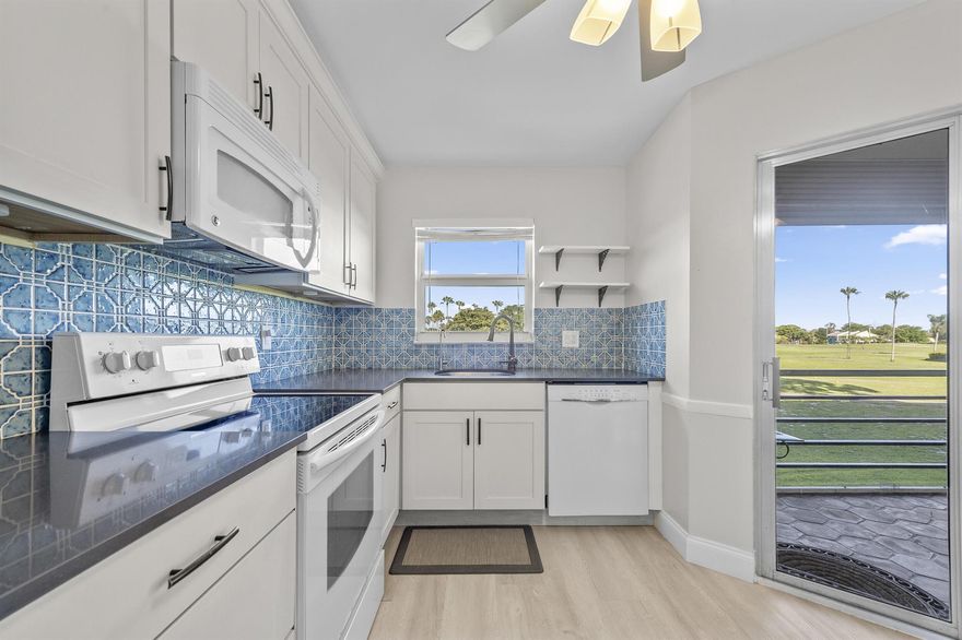 Welcome to this beautifully upgraded true corner unit in the highly sought-after 55+ community of Poinciana Place in Lake Worth! This spacious 2-bedroom, 2-bath condo is filled with natural light from extra windows and offers enhanced privacy with its end-unit location. Enjoy the Florida lifestyle from your oversized screened-in patio, where you'll be treated to expansive, panoramic views of the manicured golf course — the perfect spot to relax with morning coffee or unwind at sunset. The patio also features roll-down hurricane shutters for added protection and peace of mind. Step inside to a bright, open layout featuring new modern ceiling fans and lighting fixtures throughout, along with tasteful new window treatments that complement the home's clean, updated look. The living and dining areas showcase stunning laminate flooring, and you'll appreciate the impact windows in the dining room and kitchen, bringing in natural light while offering extra security and energy efficiency. The gourmet kitchen is a showstopper with soft-close cabinetry, a tile backsplash, quartz countertops, and a brand-new refrigerator. The unit also includes a newer A/C, a new in-unit washer and dryer, and new automatic door locks for added convenience and peace of mind. The spacious primary suite features a walk-in closet and private en-suite bath, while the second bedroom offers flexibility for guests or a home office.
This condo is equipped with an ADT security system with fire detection, adding an extra layer of safety for full-time or seasonal residents. Plus, enjoy the prime parking spot just steps from the building. Front door camera included! Poinciana Place offers resort-style 55+ living with a clubhouse, pool, fitness center, tennis, pay-as-you-play golf, on-site restaurant, and a full calendar of social events. Conveniently located near shopping, dining, hospitals, Wellington, and just a short drive to the beach and Turnpike. This move-in ready, tastefully upgraded corner unit offers beautiful golf course views, peace of mind, and a truly easy lifestyle! Schedule your private showing today!