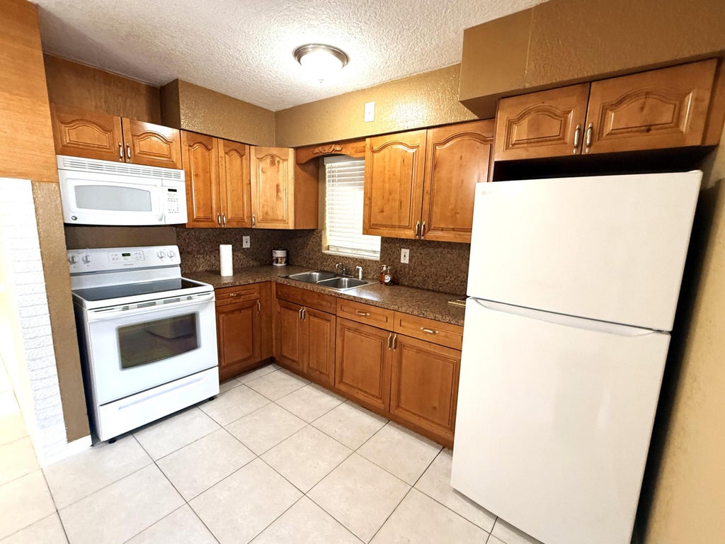 Photo of 551 SE 15th Street #W, Pompano Beach, FL 33062 (MLS # B26016638)