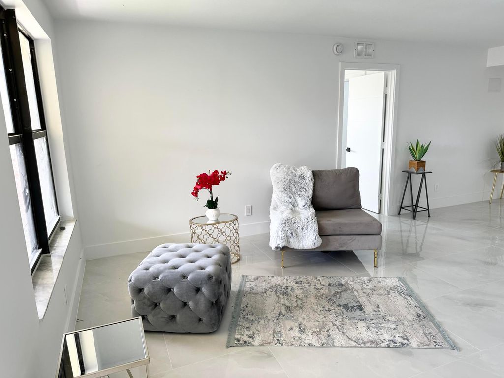 Photo of 10033 Winding Lake Road #204, Sunrise, FL 33351 (MLS # B26002196)