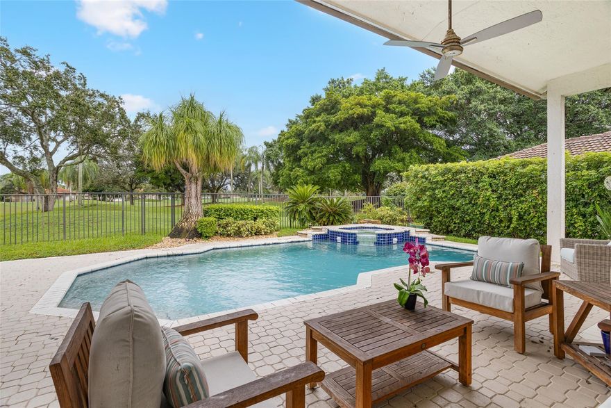 Discover this beautifully renovated POOL HOME located in the exclusive WESTON HILLS COUNTRY CLUB, perfectly situated on the golf course with spectacular open golf views. Designed with an expansive open floor plan, the home features four (4) spacious bedrooms plus an open den ideal for a home office or additional lounge space. Marble floors flow throughout the living areas, complementing the sleek, modern kitchen with a large center island, perfect for entertaining. The bathrooms have been tastefully updated, and the home is equipped with impact windows for added safety and energy efficiency. New AC and Electric car charger in the garage. Sophisticated and move-in ready, this residence offers luxurious living in one of Weston’s most prestigious communities.