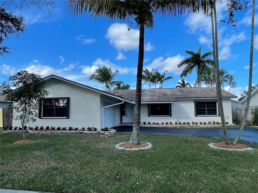HIGHLY SOUGHT AFTER FLAMINGO GARDENS WEST NEIGHBORHOOD IN COOPER CITY!!!*** LOCATED IN THE A+ SCHOOL SYSTEM OF COOPER CITY, THIS 3 BEDROOM, 2 BATH W/2 CAR GARAGE IS TURN KEY AND READY TO GO! VAULTED CEILINGS W/SPLIT FLOOR PLAN FOR ADDED PRIVACY. OPENED TO THE FAMILY ROOM, UPDATED KTICHEN WITH RAISED WOOD PANEL CABINETS, GRANITE COUNTERS AND STAINLESS STEEL APPLIANCES. NEW VANITY IN MASTER BATH AND COMPLETELY UPDATED SECOND BATH.LAMINATED WOOD FLOORS THROUGHOUT BED ROOMS. NO HOA.