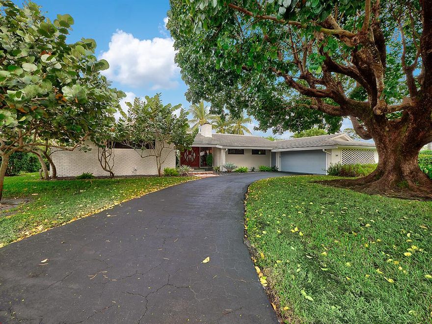 You will fall in love upon entry with the modern mid century architectural vibe flowing through this immaculate 3 bedroom, 2.5 bath home with dual 2 car garage entries.  The architecture evokes a feeling of openness, simple lines, and one with nature! Sited graciously on approx. 1/3 of an acre corner lot nestled within a cul-de-sac the home has many custom features:  Amenities include: Impact windows (except front door and french doors leading to patio) Mahogany double doors, newly renovated master bathroom, light filled sunroom with glass panel doors, polished and restored Terrazzo and concrete floors, vaulted California 4X4 Cedar wood ceilings, 2 wood burning fireplaces, bright and white island kitchen with stainless steel appliances, roof 2004 granite countertops, desirable split bedroom plan, separate screen patio overlooking heated pool, privately fenced and hedged backyard for the ultimate in relaxation and fun!  Additional improvements: freshly painted exterior & interior, new guest bathroom faucets, new landscaping in front and rear beds, podocarpus hedge on north side, decorative rocks in lanai and garden areas & more!  

The City of Atlantis is a gated, manicured country club community offering 2 championship golf courses with no membership obligations. Kintz Park at The City of Atlantis, where families and residents gather to play tennis, attend a party or City sponsored events in the Club room, Playground for kids, a covered picnic area and a water park for fun! Conveniently located close the beaches, I-95 and in between major airports.