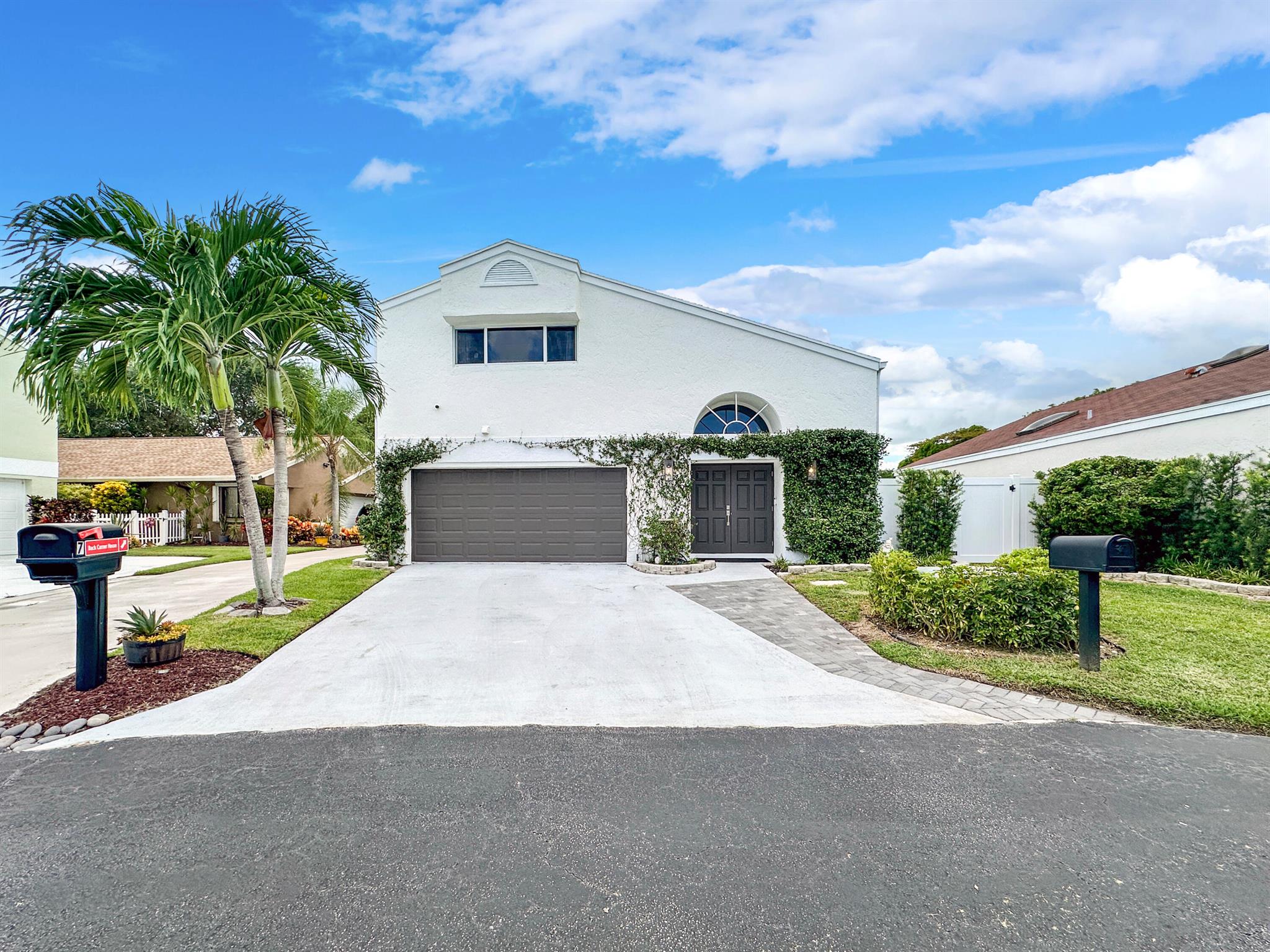 Welcome to this beautifully renovated 3 bedroom, 2.1. bathroom home with nearly 2,000 sqft of living space, perfectly situated on a quiet cul-de-sac in desirable Boynton Lakes. Every major upgrade has been completed for you in 2024: new roof, new impact windows and doors, new waterproof vinyl flooring, new PVC fenced yard, new patio tile, updated landscaping, and epoxy garage floor.Inside, enjoy soaring ceilings, a spacious two-story layout, and a brand-new bar. The home also features a whole-house charcoal water filtration system plus a reverse osmosis drinking filter at the kitchen sink for the highest water quality. Additional updates include a newer washer/dryer, utility sink, AC (2017), and water heater (2024).
