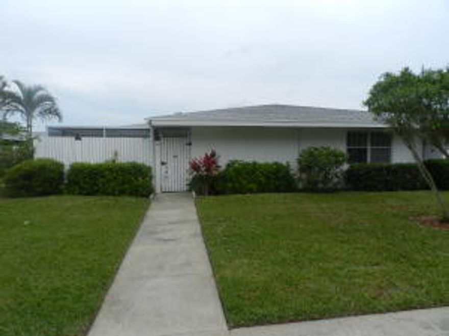 Cozy 1 bedroom, 1 bath villa in the all age section of Greenway Village.Property is fully tiled throughout and has a large great room.Relax in the privacy of your fenced, screened in covered patio.This unit also includes an assigned parking space in covered carport.Greenway Village is located in prime location of Royal Palm Beach, close to shopping dining, hospitals and highways. The subdivison has a clubhouse, swimming pool, exercise facility, shuffleboard and common area laundry facility. Low HOA fees include basic cable, pest control & exterior building insurance to name a few. Property can be rented after 2 years of ownership.