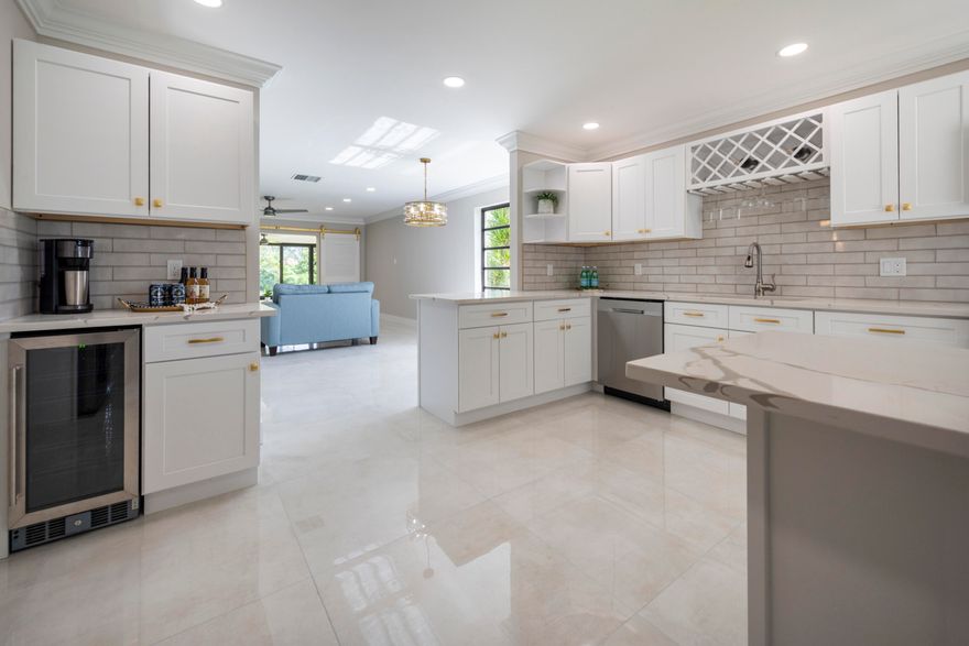 Beautifully remodeled 2/2 condo located in the highly sought-after 55+ Boca Lago golf community.  Condo is filled with designer touches including ceramic tile throughout, fully updated kitchen and bathrooms with quartz countertops and backsplash, stainless appliances, wine cooler, designer hardware and ceiling fans.  Beautiful view of the golf course from a glass-enclosed Florida room.  Located in the heart of West Boca with quick access to amazing shopping and dining.  Golf and country club membership available but not mandatory.