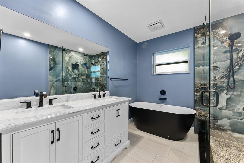 Photo of 901 NW 49th Street, Deerfield Beach, FL 33064 (MLS # B26030118)