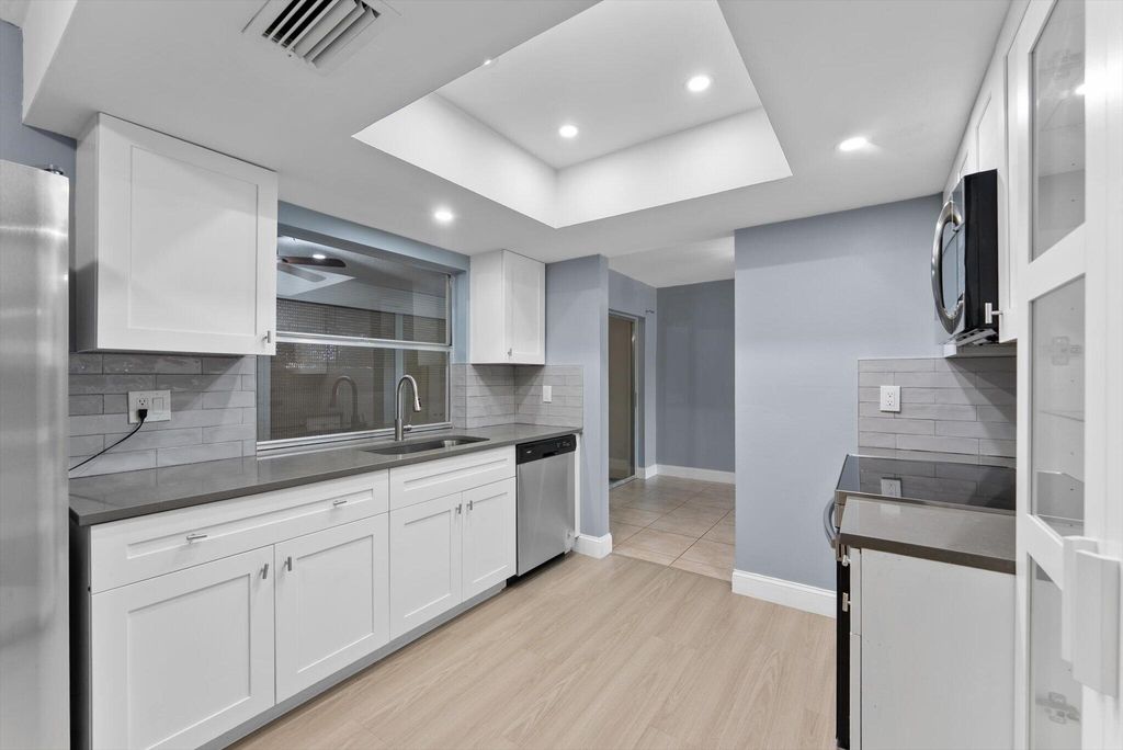 Photo of 901 NW 49th Street, Deerfield Beach, FL 33064 (MLS # B26030118)