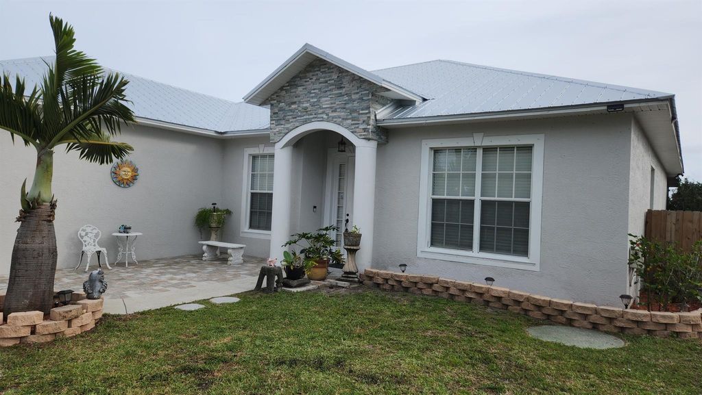 Photo of 1590 SW Wepaco Avenue, Port Saint Lucie, FL 34953 (MLS # R10965034)