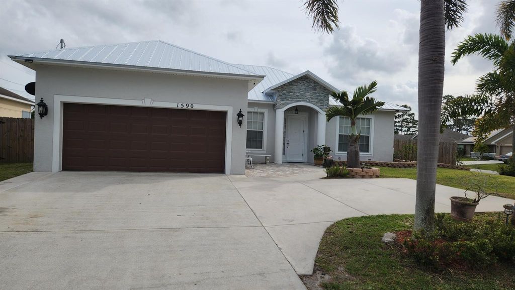 Photo of 1590 SW Wepaco Avenue, Port Saint Lucie, FL 34953 (MLS # R10965034)