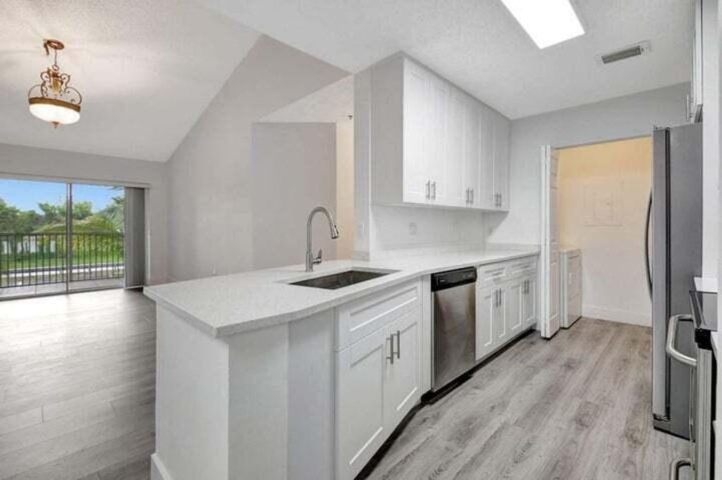 Photo of 3111 Clint Moore Road #202, Boca Raton, FL 33496 (MLS # R11130657)