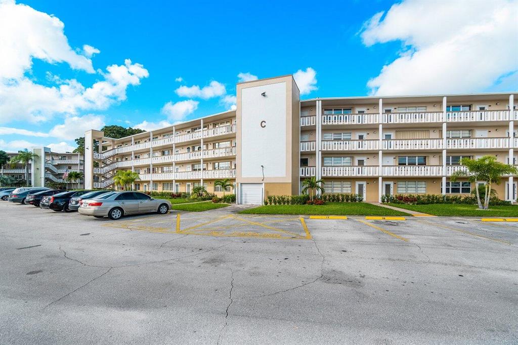 Light and bright FIRST FLOOR UNIT in Century Village. NO LEASING Spacious 1 bed 1.5 bath with assigned parking spot, steps away from front door. Unit has been updated with tile floors, private and spacious covered back patio, laundry in building and community pool close by. Come take a look!