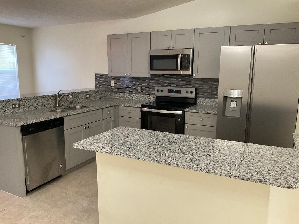 Photo of 5252 NW Gamma Street, Port Saint Lucie, FL 34986 (MLS # R11103980)