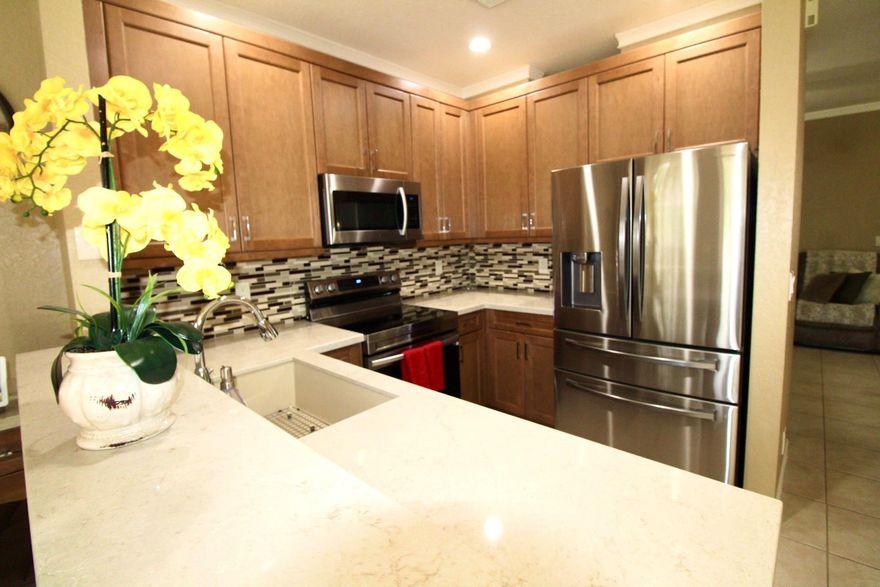 Price competitively. This fully updated 3 Beds/2.5 Bath Townhome truly has it ALL. Highly desirable & well-maintained gated community in Wyndham Lakes. A rated School District. Newer roof (Nov 2024), Freshly painted, Hurricane impact doors & windows, Newer AC & Water heater, Newly updated LVP-wood floors, Newer Stainless-Steel appliances, Updated eat-in kitchen & dining combo with built-in wood cabinets, Backyard-Custom patio pavers-perfect for entertaining & relaxing. Newer full-size washer & dryer-designated 2nd floor laundry room. Oversized primary bedroom-updated ensuite & large walk-in closet. 1 Car garage-built-in cabinets & overhead storage, driveway fits 2 more cars. Enjoy-Community pool, walking trails, parks, shopping, dining & entertainment. Close to Sawgrass Express & highways.