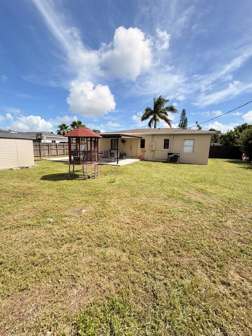Beautiful Home with a Spacious Yard!Enjoy a large, private yard with your own carport and driveway. This move-in-ready home is perfect as a starter residence or investment property. Conveniently located near schools, shopping centers, and public transportation. The Florida Turnpike is just minutes away, and the Florida Keys are less than an hour's drive!