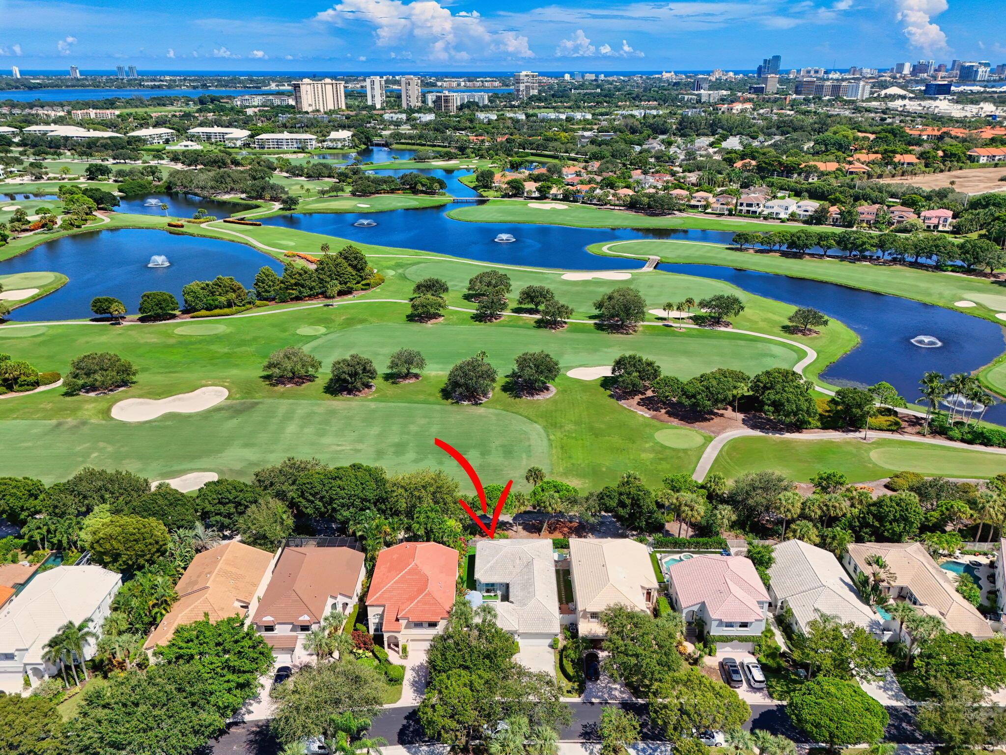 Rarely available single-story courtyard home perfectly situated on a private golf course lot! Experience the best of South Florida living with this distinctive floor plan, where the heart of the home opens to a private courtyard and sparkling pool surrounded by lush tropical landscaping. Start your mornings with coffee overlooking the tranquil fairways or unwind poolside in total privacy. The main residence boasts 2 bedrooms and 2 bathrooms, filled with natural light and highlighted by wood and tile flooring (no carpet!) The open airy design seamlessly blends indoor comfort with picturesque golf course views, creating a home that in both inviting and unique.The kitchen has been tastefully updated with plenty of cabinetry, Corian countertops, and an oversized stainless steel Kitchen Aid