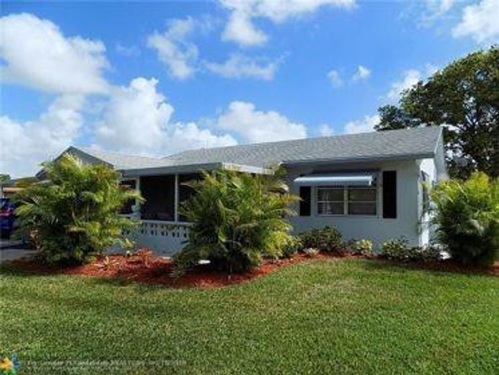 Photo of 8900 NW 70th Place, Tamarac, FL 33321 (MLS # F10550229)