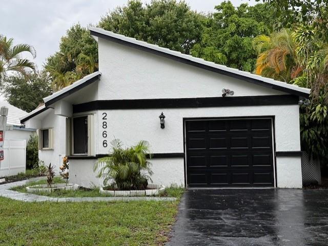 2025 BRAND NEW CONCRETE TILE ROOF...Modern 3 BR/ 2 bath home in the heart of Coral Springs. NO HOA. Spacious Living Room plus Dining Room with High Vaulted Ceilings with numerous recessed lights. Beautiful porcelain tile floors with Modern Baths and Quartz Kitchen with New Stainless Steel Appliances. Accordion Hurricane Shutters. Central A/C is 5 years old. Detached Shed with finished floors & electric that could be a workshop or small home office. New garage door and motor. Walking distance to the Coral Springs Charter School, Broward County Library, "The Walk" for Shopping & Restaurants. ---- $$$ PLEASURE TO SHOW & SELL --