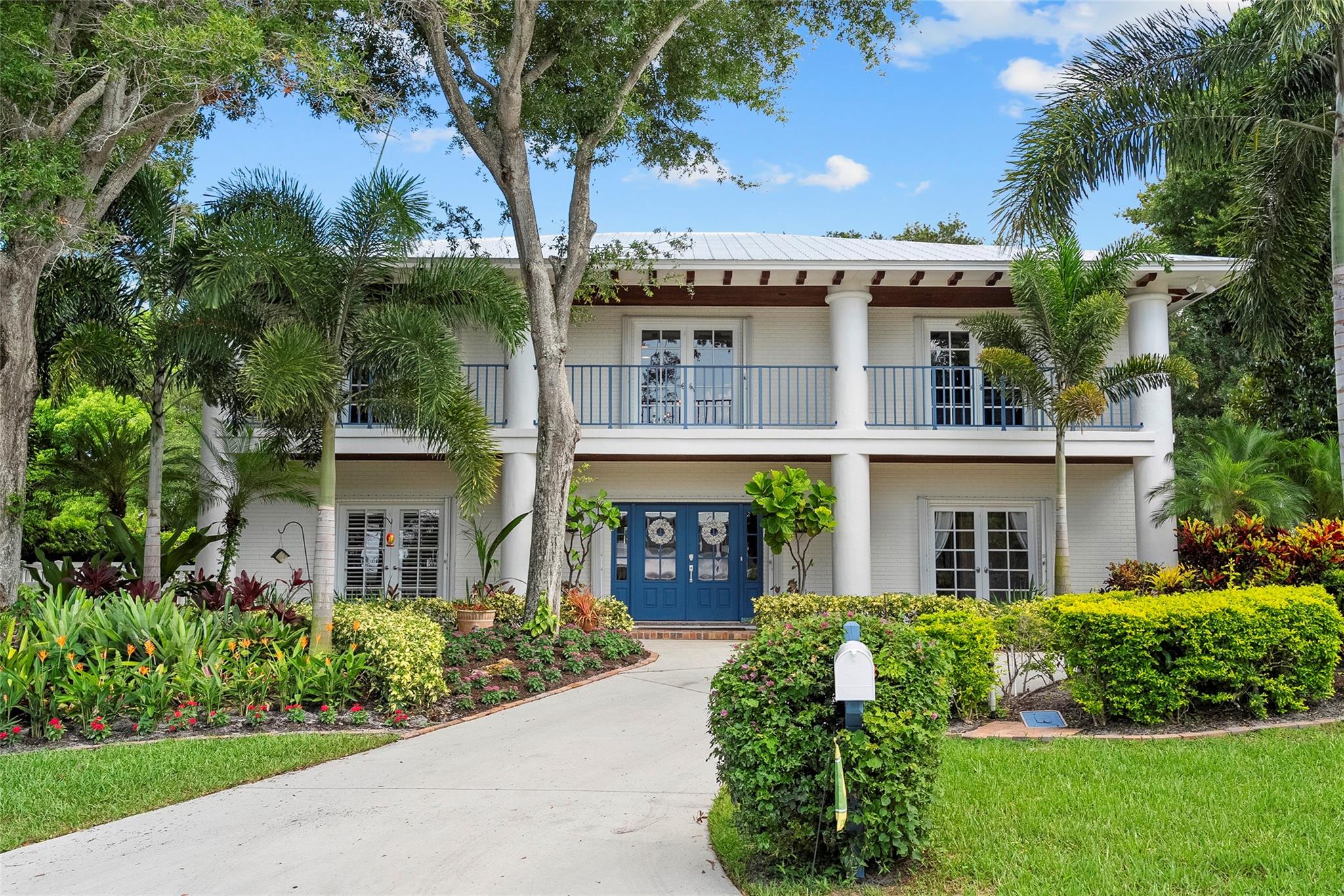 Discover refined coastal living in the exclusive community of South Sewall’s Point. This beautifully updated 5-bedroom, 4.5-bath turnkey estate blends classic elegance with modern convenience. The thoughtfully designed layout includes a gourmet kitchen, formal dining, spacious family room, first-floor guest suite, home office, and separate den. Outdoors, enjoy a heated pool, summer kitchen, and lush tropical landscaping on a high 0.41-acre corner lot. Upgrades include three 3-ton AC units, a Generac 22K generator, 500-gallon propane tank, new water heaters, rebuilt soffits and exterior drainage system, spray insulation, and a fully restored garage. Minutes from beaches, fine dining, shopping, and parks.