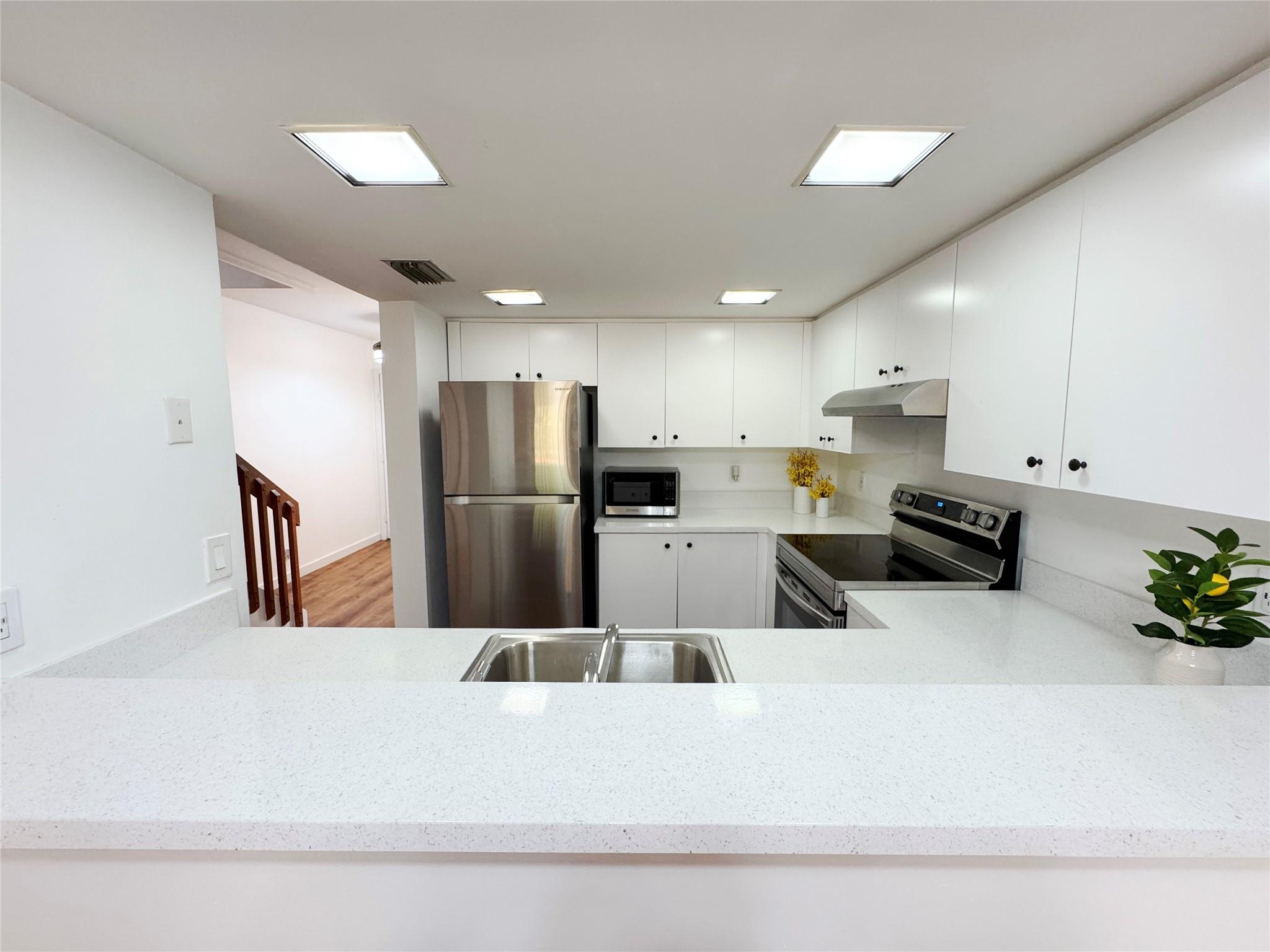 This fully renovated 3-bedroom townhouse is ideally located near NOVA University, Broward College, HCA Florida University Hospital, shopping centers, and major highways for easy commuting. This move-in-ready home boasts a range of modern upgrades, including stainless steel appliances, smart ceiling fans and lighting, and newly renovated bathrooms. The entire unit features new flooring, adding to the fresh, contemporary feel. Enjoy the outdoors from your private screened patio, and take advantage of the convenience of an in-unit washer/dryer. The property includes 2 assigned parking spaces, plus guest parking for visitors. No rental restrictions, and it’s ideal for investors. Don't miss the opportunity to make this stunning townhouse your new home!