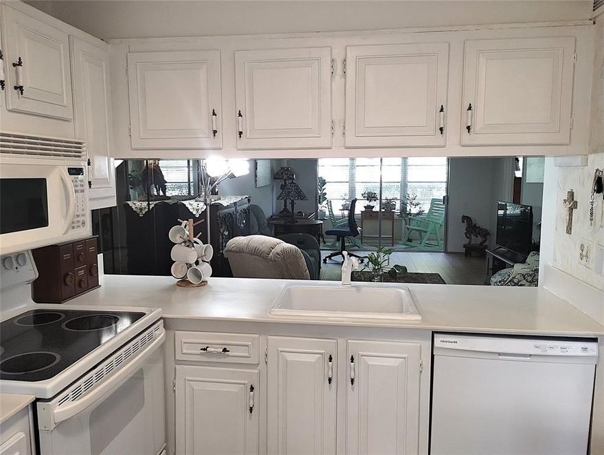 CHARMING 1ST FL GARDEN UNIT IN PRISTINE CONDITION! FULL HURRICANE PROTECTION. LARGE WOOD PLANK WATERPROOF LAMINATE FLOORS CREATES A WARM ATMOSHERE. TEXTURED KNOCKDOWN WALLS. EAT-IN KITCHEN OPEN TO THE DINING/LIVINGROOM. APPLIANCES 2021! BATHROOM VANITES & TOILETS ARE UPDATED. ALL WINDOWS HAVE 2" WHITE BLINDS. THE INVITING PATIO IS ENCLOSED & SURROUNDED BY PEACEFUL GREENERY. LOW MAINTNENCE MAKES THIS EVEN MORE DESIREABLE! WYNMOOR LIFESTYLE INCLUDES SWIMMING, DANCING, SINGING, BILLIARDS, BOCCE BALL, PICKLEBALL,TENNIS & GOLF AS WELL AS CLUBS & CLASSES GALORE, A THEATRE FOR MOVIES & LIVE SHOWS & A STATE OF THE ART FITNESS CENTER. FREE SHUTTLE BUSES ARE AVAILABLE TO TRAVEL IN & OUT OF THIS GATED COMMUNITY. WE HAVE A RESTAURANT & DR'S OFFICE ONSITE. TAKE ADVANTAGE OF THIS BUYERS MARKET NOW!